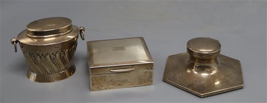 An Edwardian silver tea caddy, Walker & Hall, Sheffield, 1907, a later silver cigarette box and silver inkwell.